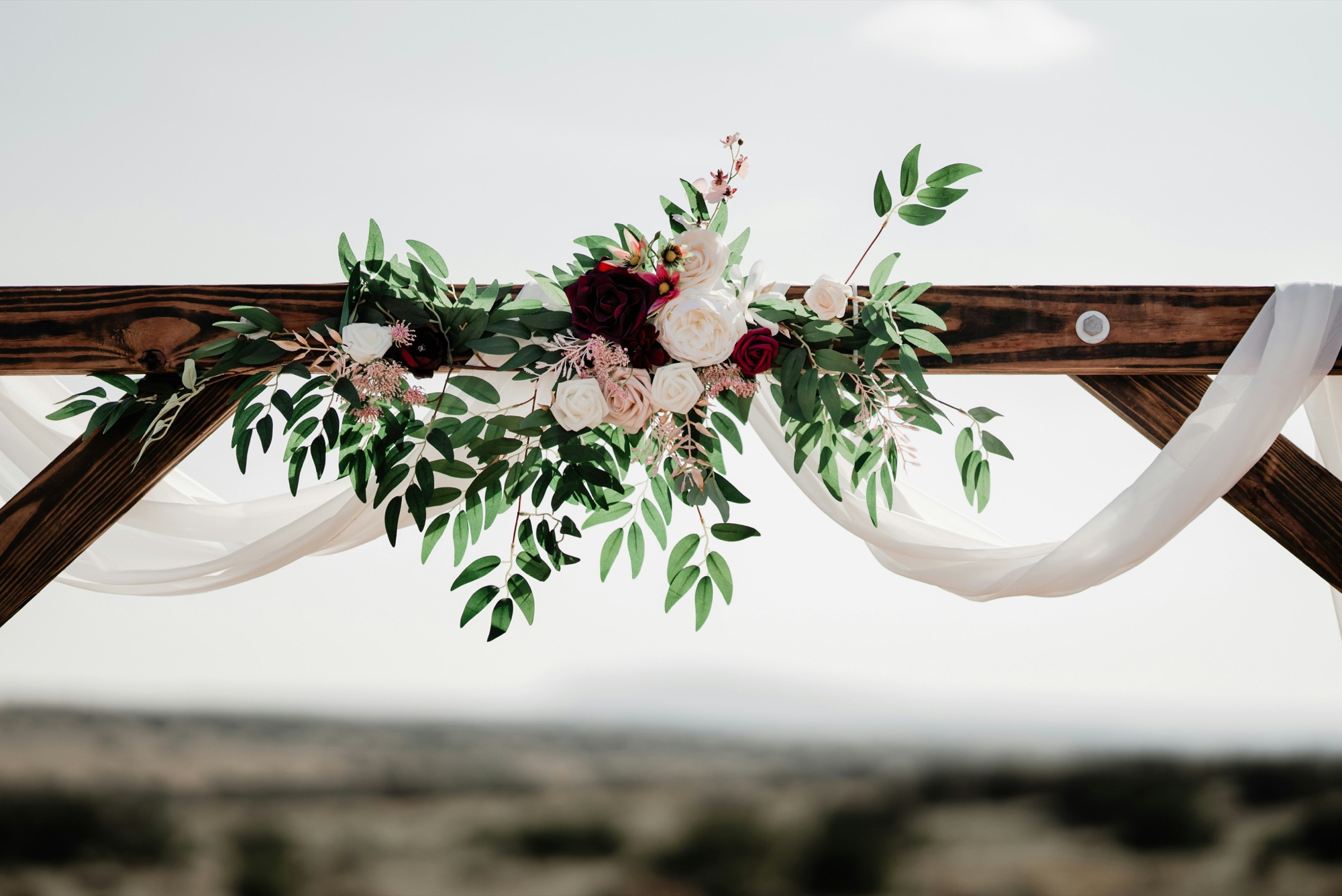 Ceremony arch with greenery